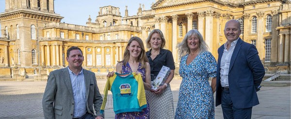 Image of Sally Dear, founder of Ducky Zebra alongside the Blenheim Palace judging panel in front of Blenheim Palace