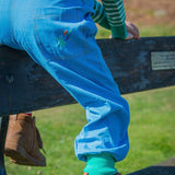 The back pocket on a pair of Ducky Zebra dungarees with their embroidered splash 'power button'