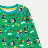 Close up image of Ducky Zebra green top with repeat print of a dog and hedgehog gardening together and playing with a wheelbarrow. The print includes pictures of pumpkins, carrots and squash. The top has a turquoise trim and yellow poppers on one shoulder for easy dressing.