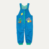 Kids' Organic Cotton Blue Dungarees with Green Zip. There is a hippo and frog appliqué peaking out of two pockets. The dungarees have green roll-up cuffs, and extendable straps with green buttons.