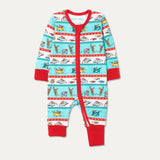 Baby Roald Dahl x Ducky Zebra sleepsuit with the arm and leg cuffs rolled up