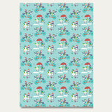 Sheet of recyclable Ducky Zebra wrapping paper, with a fun print of a Duck and Zebra cycling in the snow as they deliver presents and playing in the snow together.