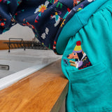 Ducky Zebra turquoise cord skirt for children, with a fun dog appliqué poking out of the pocket