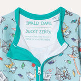 Image of baby sleepsuit label, which includes the quote from Roald Dahl "No book ever ends when it's full of your friends"