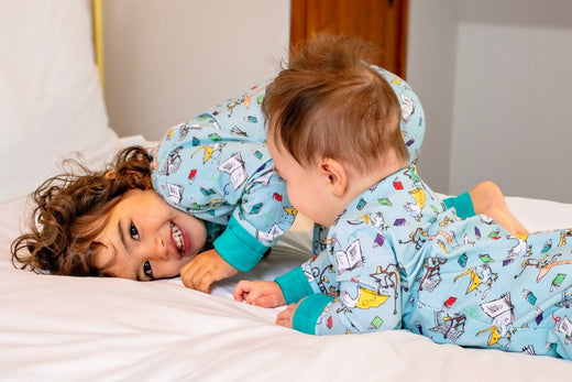 Children wearing Ducky Zebra sustainable Pyjamas and Sleepsuits with Roald Dahl Print