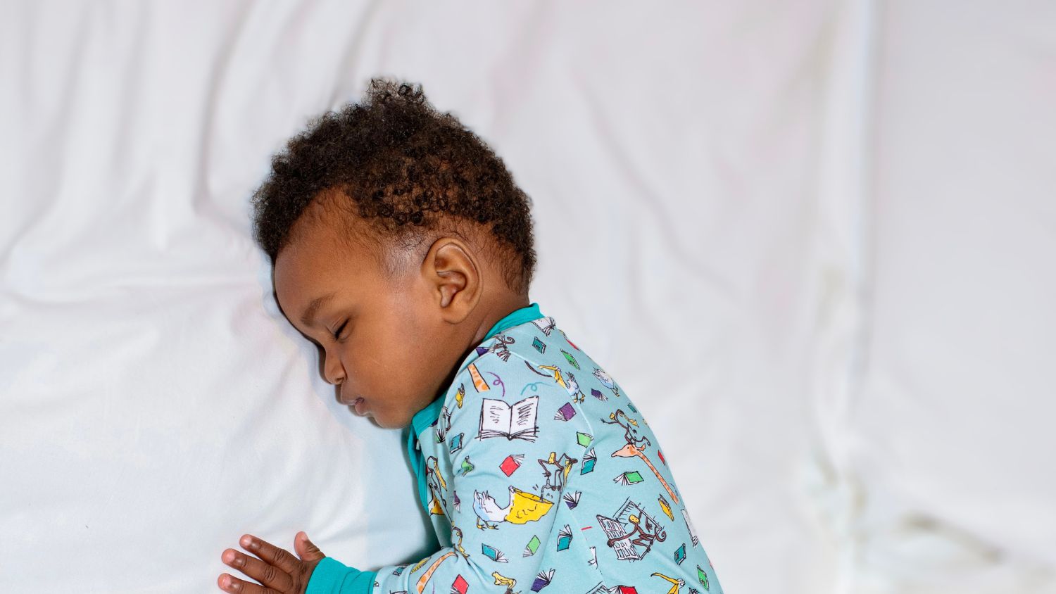 Baby Sleeping - while wearing Ducky Zebra Organic Cotton UnisexSleepsuit