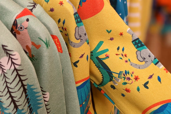Image of colourful Ducky Zebra baby sleepsuits
