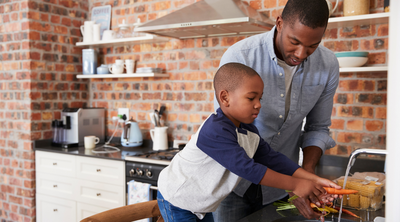 Image of a boy and father preparing a meal together
