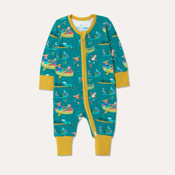 Teal Baby Sleepsuit with fun repeat print pattern of a highland cow and otter rowing and wild swimming. The sleepsuit has contrasting mustard yellow cuffs and a full length zip. 