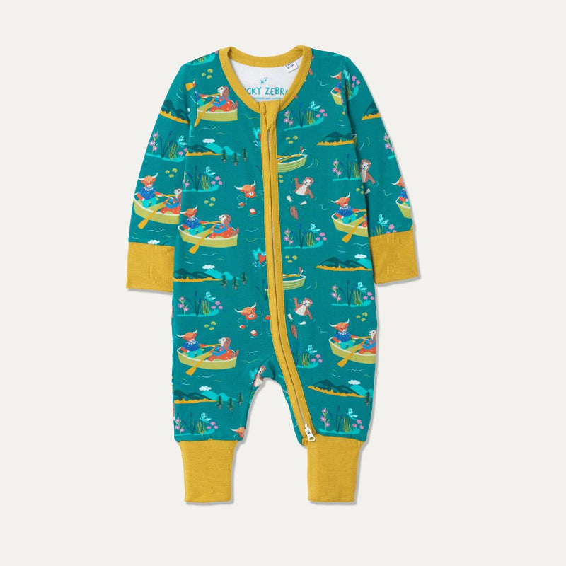 Teal Baby Sleepsuit with fun repeat print pattern of a highland cow and otter rowing and wild swimming. The sleepsuit has contrasting mustard yellow cuffs and a full length zip. 