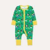 Baby zip-up sleepsuit with a green background and repeat print of a dog and hedgehog playing with a wheelbarrow and gardening together. The sleepsuit has a contrasting yellow zip, cuffs and chin guard. The yellow cuffs are rolled down in the photo.