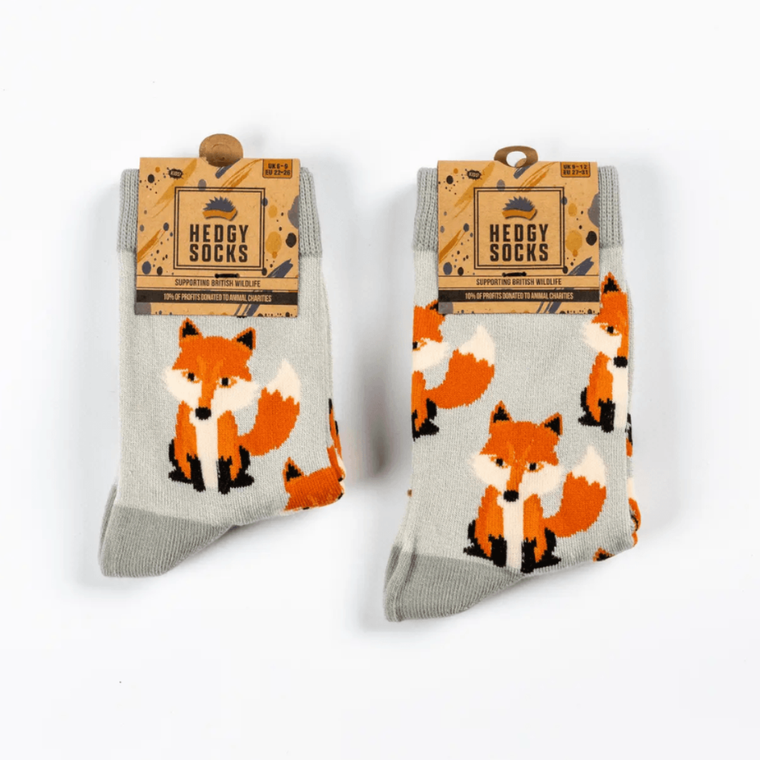 Two pairs of Hedgy children's fox socks - with a light grey background and orange and white repeat foxes.