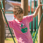 Child wearing a coral-pink and white striped t-shirt with a green boat-shaped pocket. The child is climbing on playground equipment