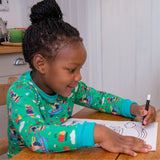 Image of a child colouring, while wearing a green Ducky Zebra top with a repeat print pattern of a dog and hedgehog gardening
