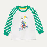 Unisex  raglan top with a print of a cycling, kite flying hippo and a green and white stripe arm and cuff.