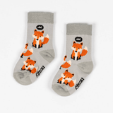 Pair of Hedgy fox bamboo socks with a light grey background and repeat ox pattern