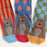 Close up of three pairs of children's socks with bears on each. The socks are brightly coloured with stripes, cheques and spots.