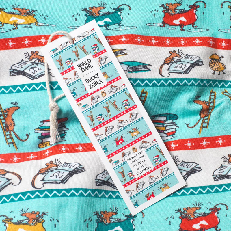 Close up of Roald Dahl x Ducky Zebra sleepsuit fabric with mice reading books and splashing in the bath. There's a matching bookmark on top of the fabric.
