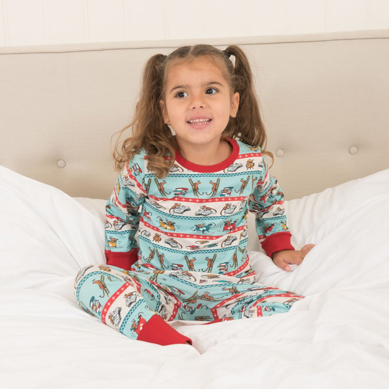 Child wearing Roald Dahl x Ducky Zebra 'bedtime mice' pyjamas - with a festive, Christmas feel.