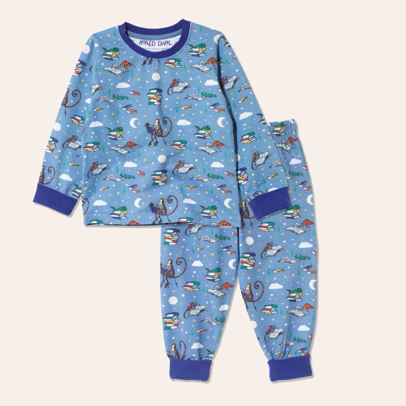 Unisex pyjamas with a fun Roald Dahl print, including a monkey, frog and newt reading together. The repeat print is on a forget-me-not background with a purple trim.