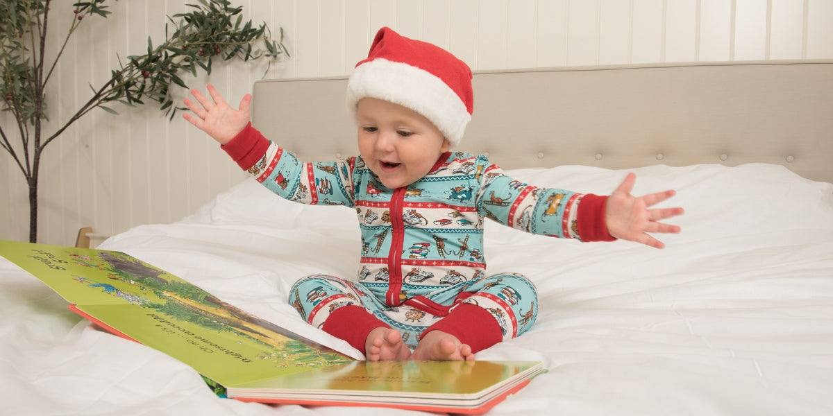 Baby in Christmas Roald Dahl  x Ducky Zebra Pyjamas - reading a book