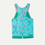 A close up of the back of a pair of short dungarees, rolled up showing a green trim and an embroidered splash motif on the back pocket