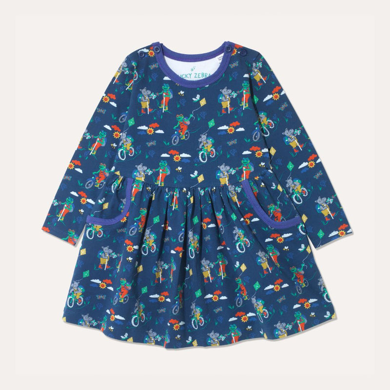 Navy blue skater dress with purple trim and repeat print of a frog and hippo cycling and walking on the Yorkshire Moor