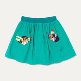 Ducky Zebra turquoise cord kid skirt with a fun dog and hedgehog appliqué poking out of two pockets. The skirt has a teal, elasticated waistband and a teal embroidered splash 'power button' on the front of the pocket.