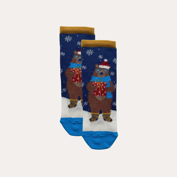 Pair of kids' socks with a smiling bear wearing a Christmas hat