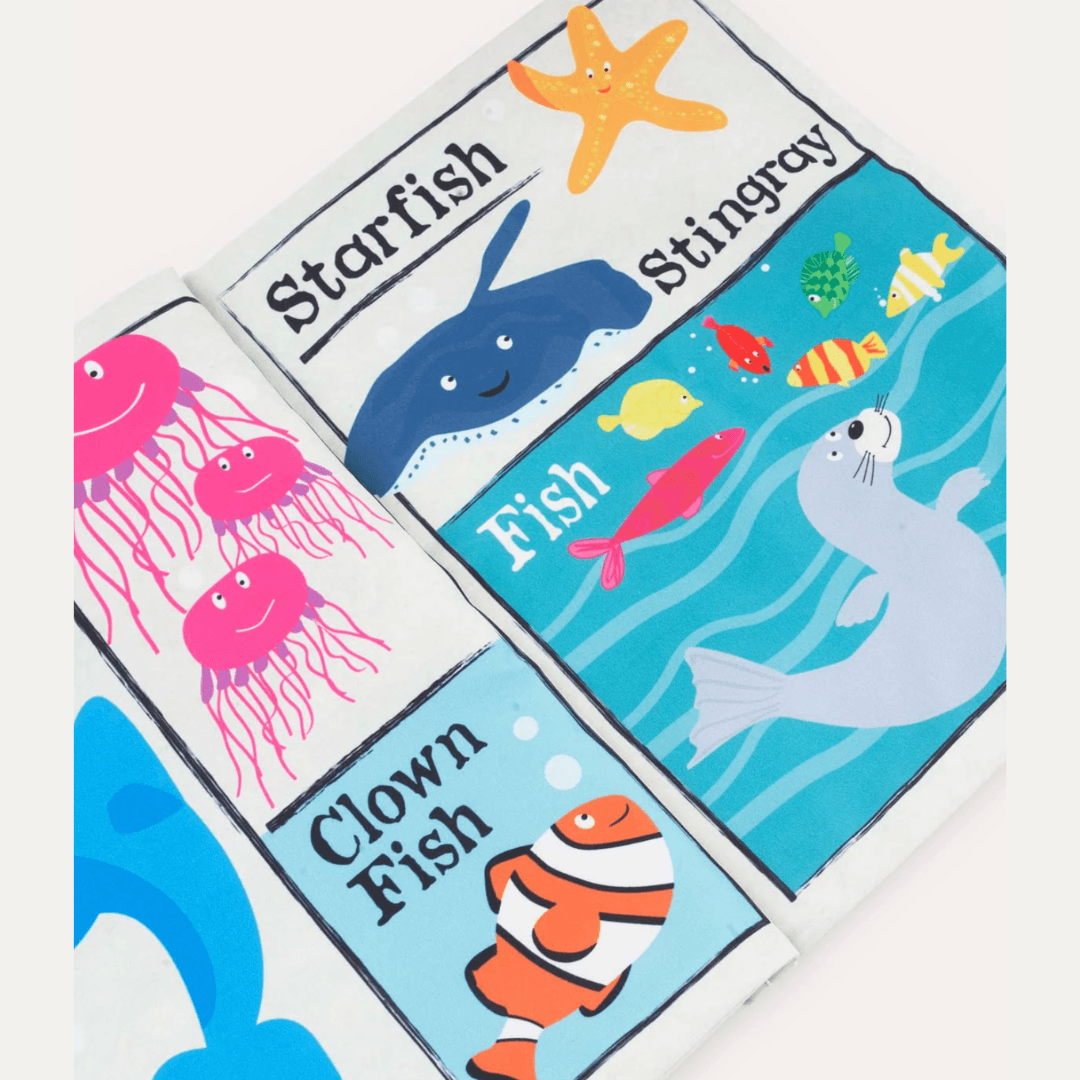 Close up of a Crinkly Cloth newspaper with images of a seal, clown fish, octopus and star fish