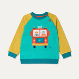 Children's sweatshirt with a highland cow and elephant driving a fire engine. The sweatshirt has a turquoise background and mustard yellow sleeves.
