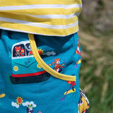 Close up image of a pocket with a yellow trim on a pair of teal Ducky Zebra trouser