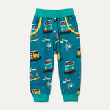 Ducky Zebra teal joggers with a turquoise waistband and cuff. The trousers have two deep pockets and a repeat print pattern of animals playing with campervans and paddleboards. 