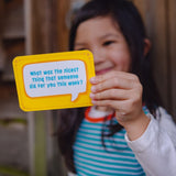 Image of a girl wearing Ducky Zebra clothes holding up one of the Conversation Cards, which asked "What was the nicest thing that someone did for you this week?"
