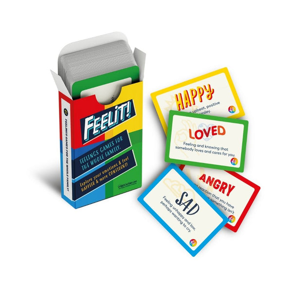 Image of a pack of FEELIT! cards with some of the cards laid out on the table, including sad, angry, loved and happy