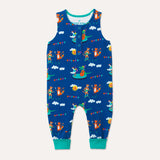Image of unisex baby sleeveless romper with blue background and colourful repeat print pattern of a duck, crocodile, cheetah and fox playing at a festival. The image shows turquoise roll-up leg cuffs and four turquoise poppers on the front placket