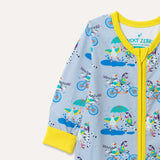 Image of a zip-up unisex baby romper with a light grey background and colourful repeat print pattern of a duck and zebra splashing in a puddle, riding a bicycle and running a three legged race. The images focuses on the top half of the romper, showing the bright yellow arm cuffs, trim and a two way zip