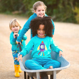 Children having fun in a wheelbarrow, wearing colourful unisex Ducky Zebra clothes